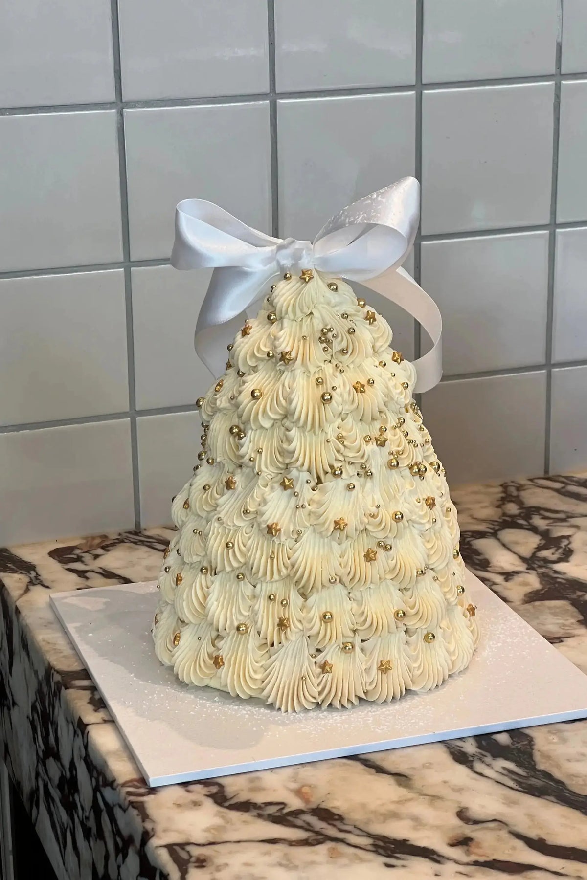 Brooki Christmas tree cake on a marble bench
